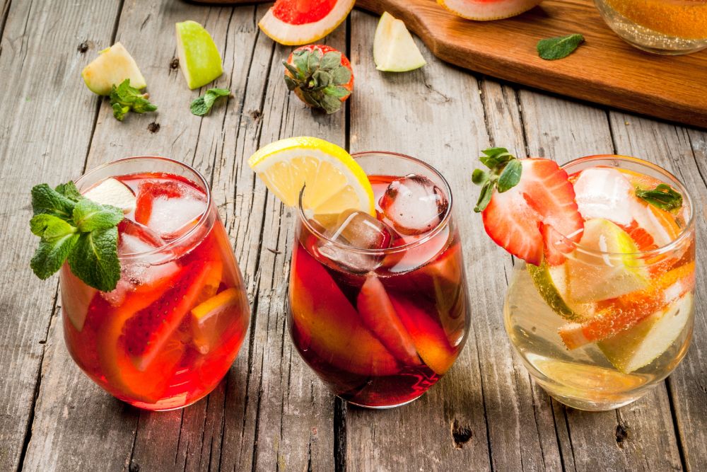 Pink, Red and White wine sangria cocktail with fruit