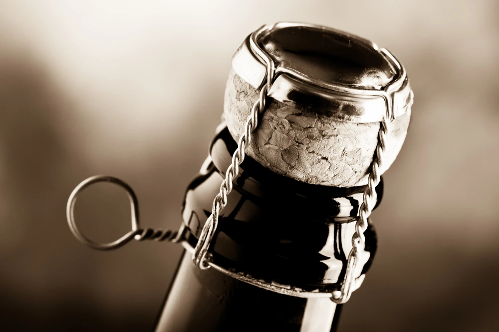 Close up of sparkling wine corkscrew in black and white