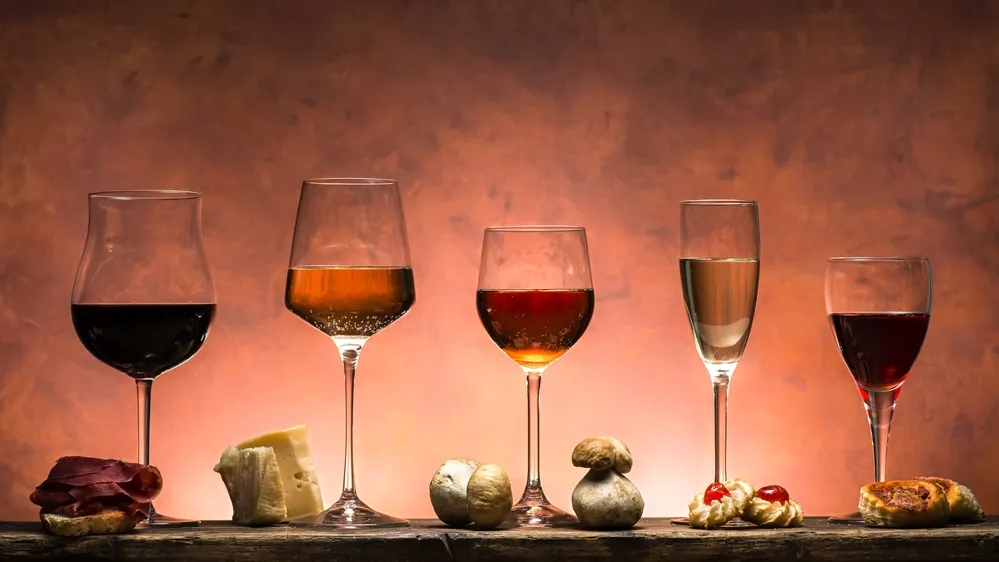 Set of different types of wines with food pairing