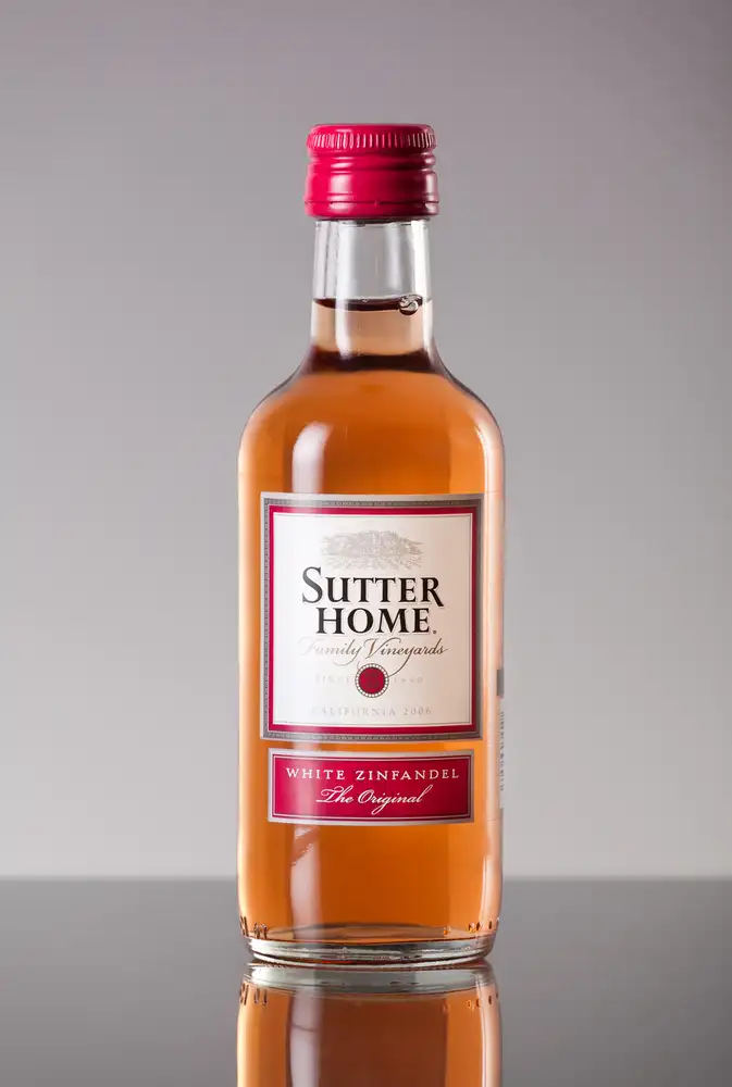 Bottle of Sutter Home White Zinfandel the original on a grey background