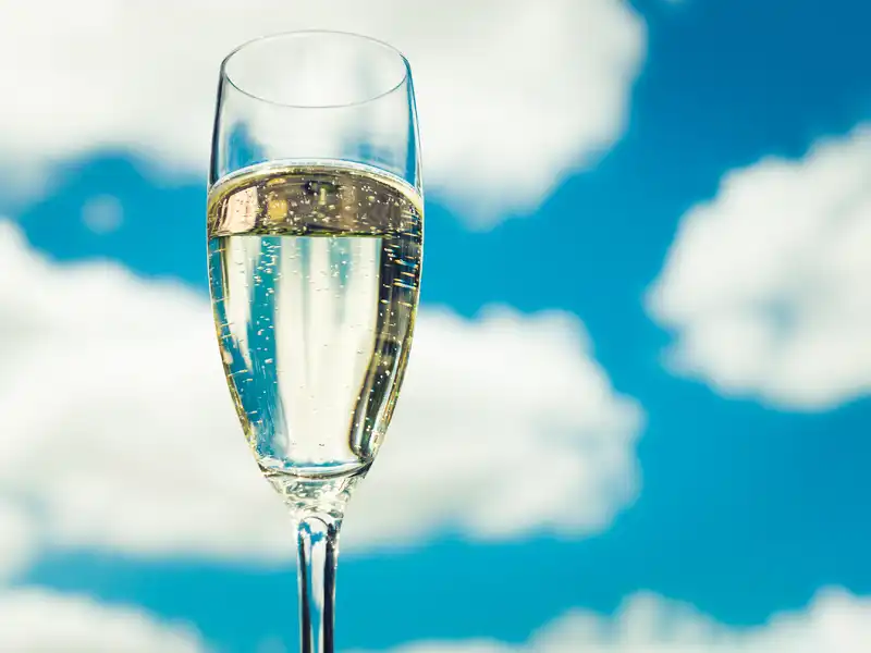 Glass of Prosecco with blue sky background