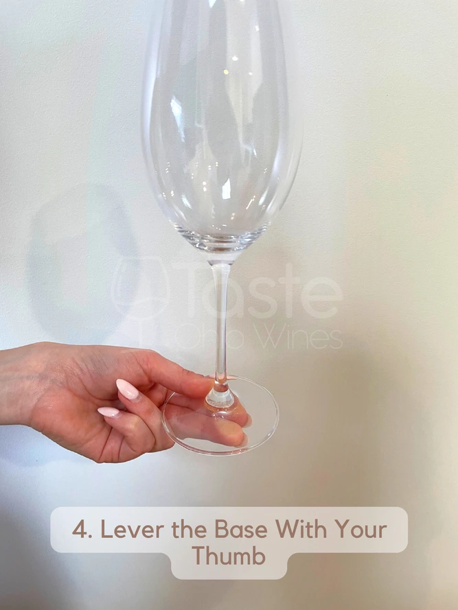 How to Hold a Wine Glass With a Stem 4. Lever the Base With Your Thumb