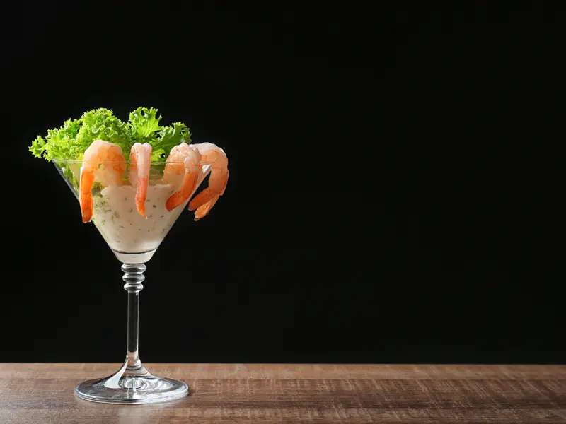 Glass with Shrimp Cocktail and Sauce on Table